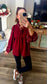 Burgundy babydoll blouse styled with leggings and sneakers