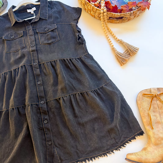 Angled view of tiered skirt on washed black Umgee plus shirt dress