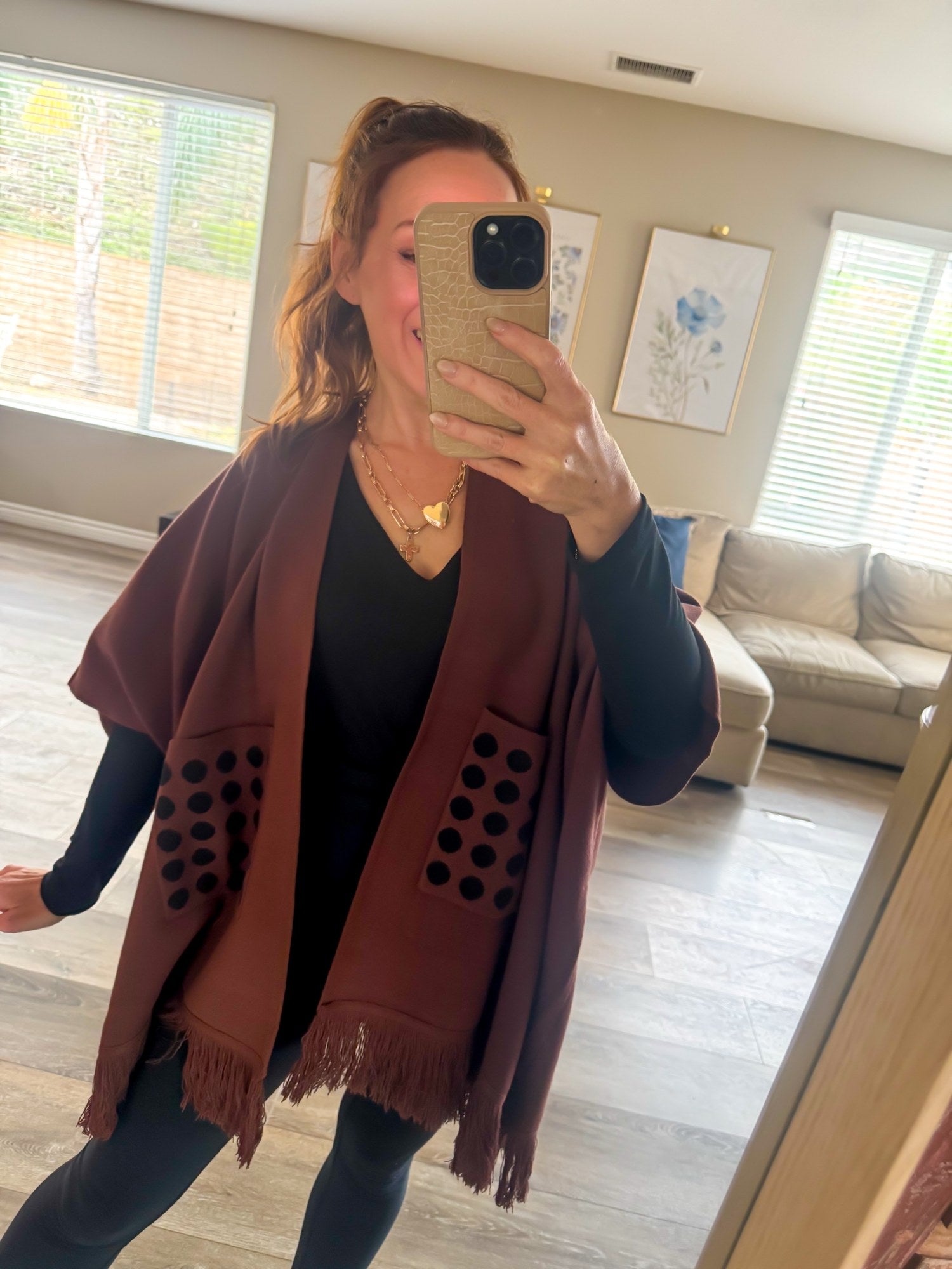 Brown poncho fringe hem detail