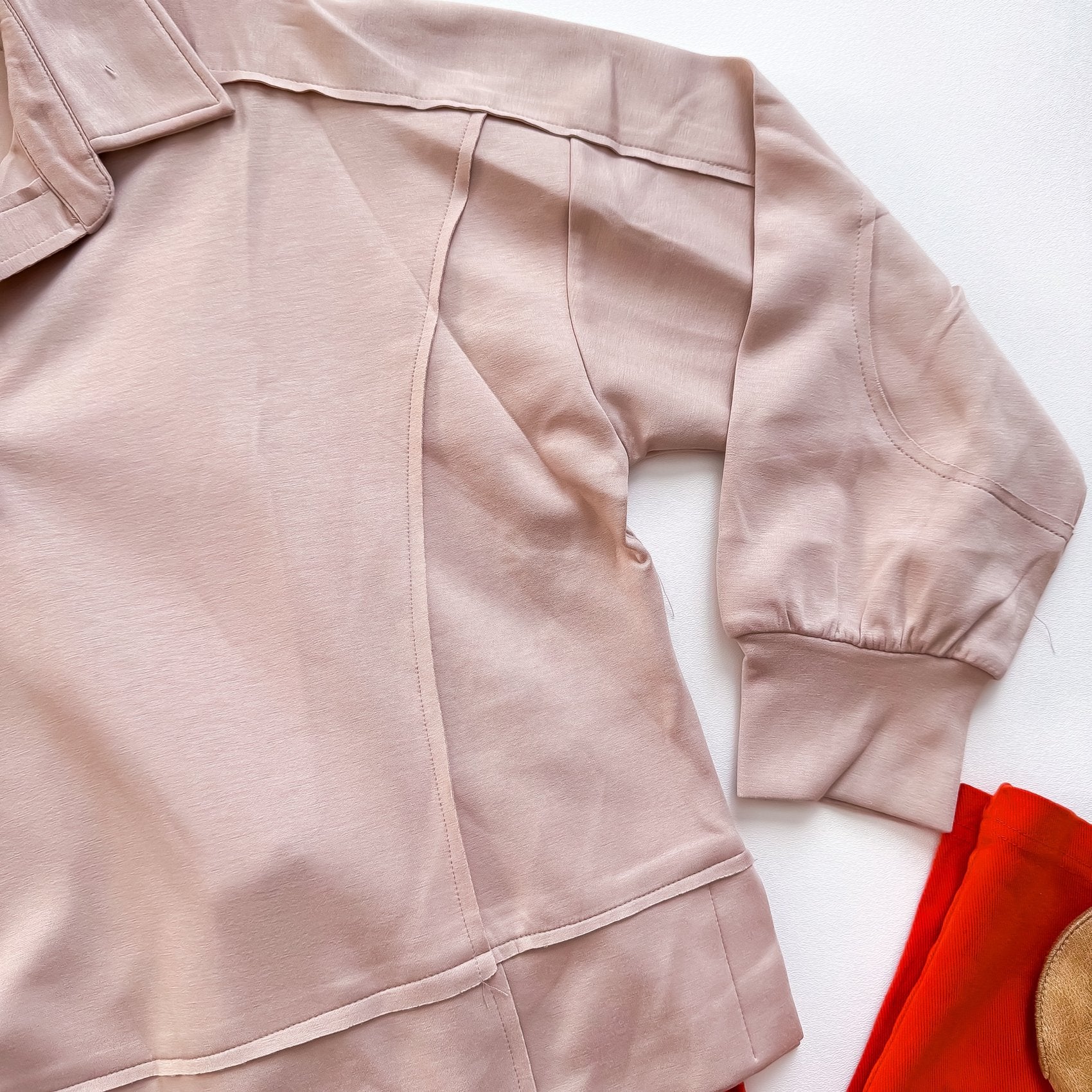 Taupe polo pullover seam detail