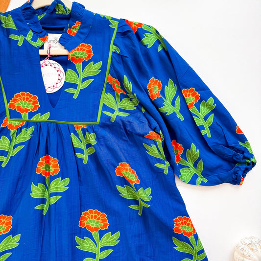 Marigold floral dress bib and sleeve detail