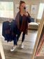 Navy poncho with caramel polka dot pockets