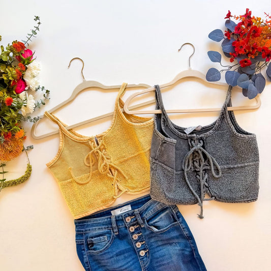 Mustard and grey lace-up terry crop tanks flat lay