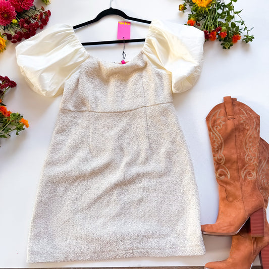 Cream tweed puff sleeve mini dress styled with cowboy boots