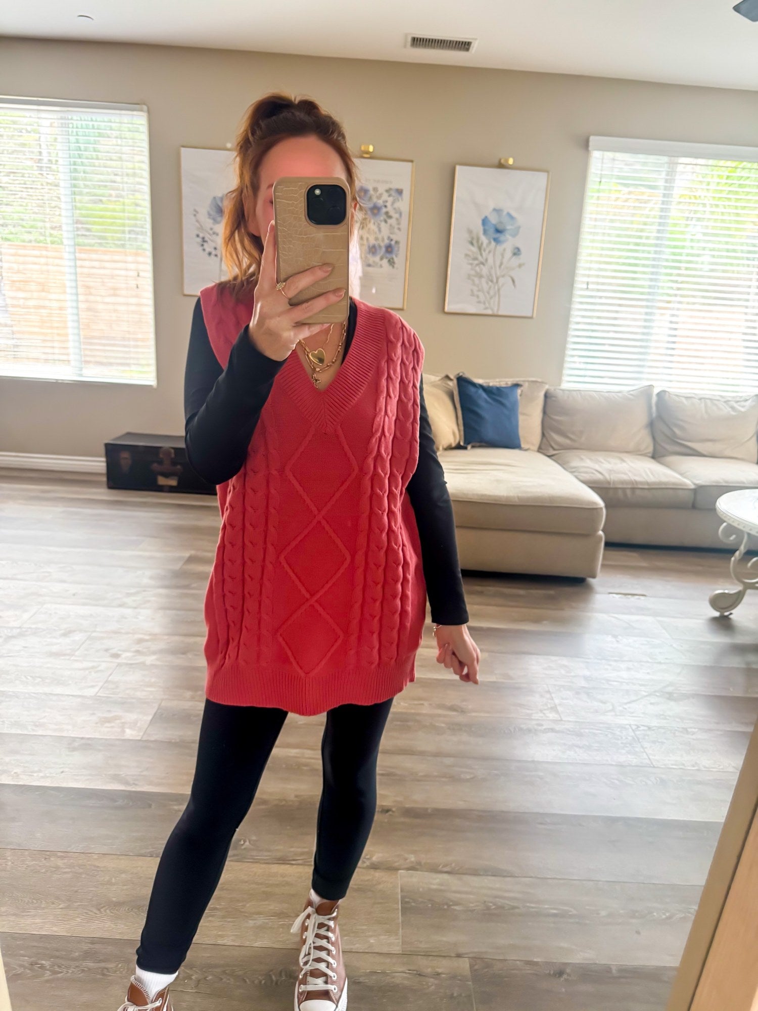 Spiced Cranberry Cable Vest styled with leggings and high tops