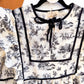 Umgee toile top bib and tie neck detail
